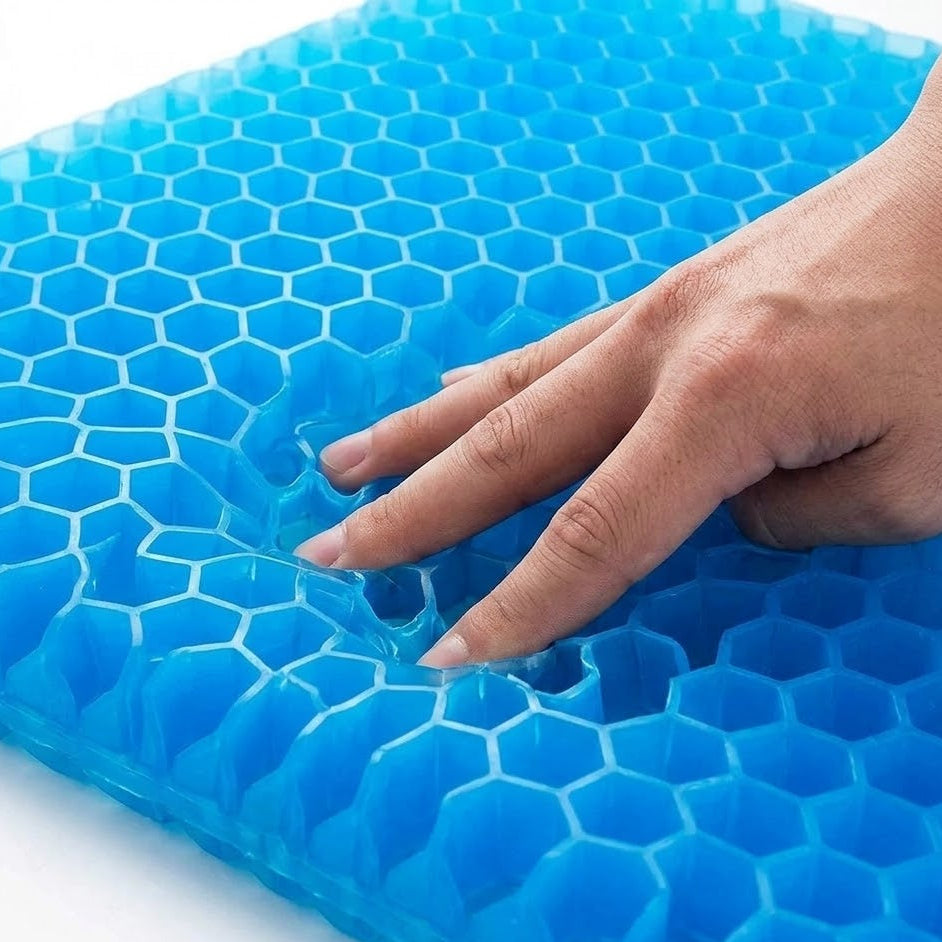 Blue honeycomb gel pack with a hand pressing on it